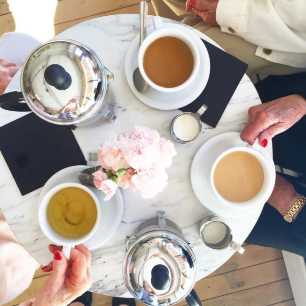 Friends meeting for coffee and French macarons at Le Bon Macaron in Grand Rapids Michigan.