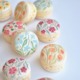 Assorted spring French macarons with floral designs