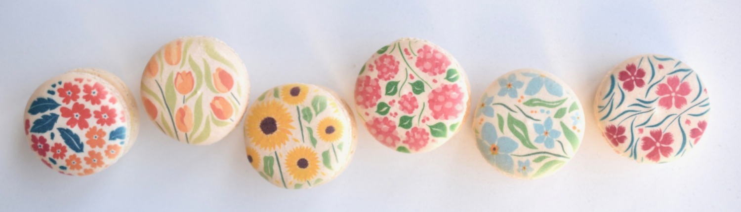 Handcrafted French macarons in seasonal spring patterns