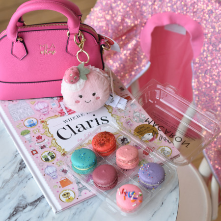 Claris children's book, Mila and Rose sequin jacket and girl's purse, Le Bon Macaron French macarons, and kiddie cappuccino at Holland cafe.