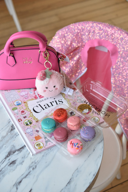 Claris children's book, Mila and Rose sequin jacket and girl's purse, Le Bon Macaron French macarons, and kiddie cappuccino at Holland cafe.