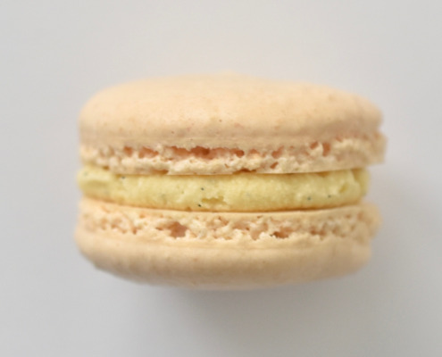 Vanilla French macaron featuring cream macarons shells filled with a vanilla bean buttercream.