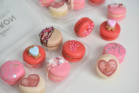 Assortment of French macarons in red and pink for Valentine's Day at Le Bon Macaron