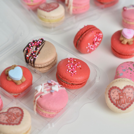 Assortment of French macarons in red and pink for Valentine's Day at Le Bon Macaron