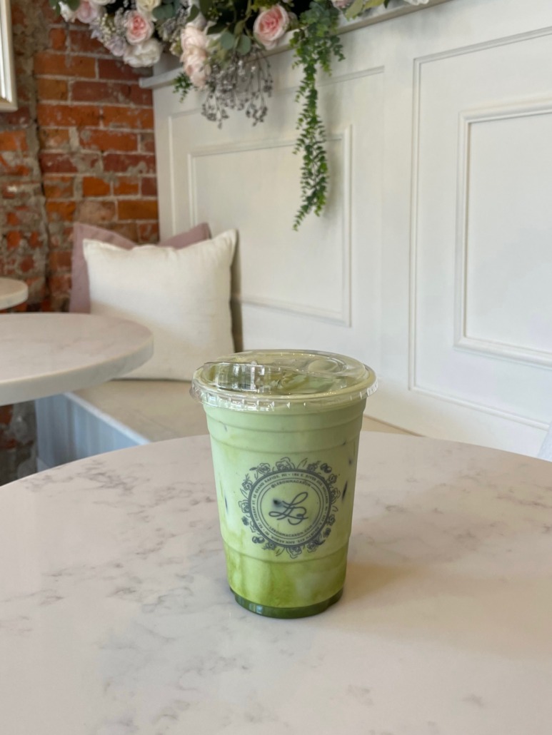 Iced Matcha latte on a table at the Le Bon Macaron cafe in Ann Arbor, Michigan.