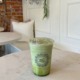 Iced Matcha latte on a table at the Le Bon Macaron cafe in Ann Arbor, Michigan.