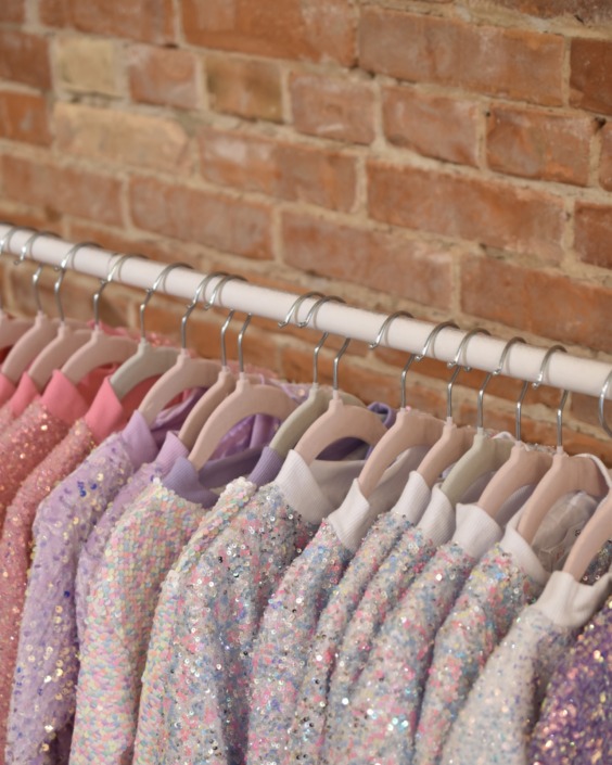 Mila & Rose Sequin Jackets A display of Mila & Rose sequin jacket in an array of colors.